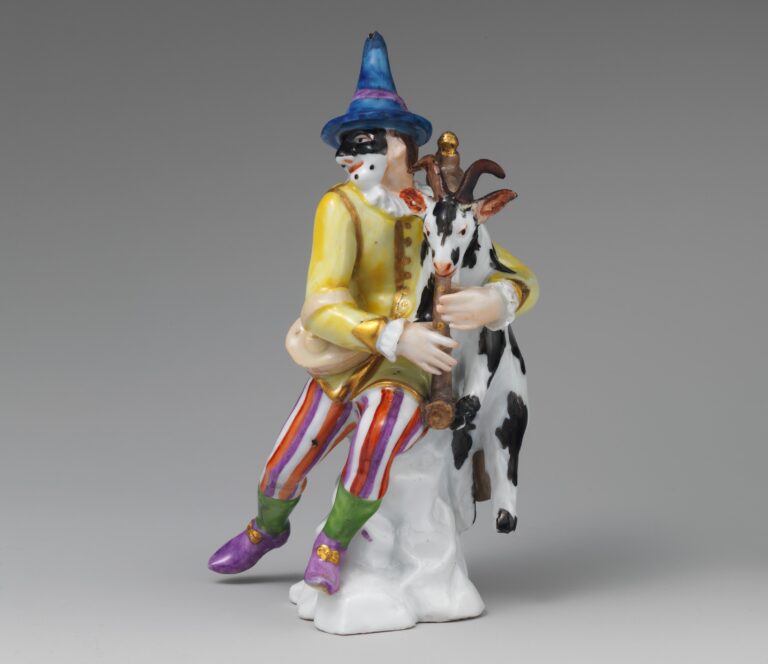 Bagpipes of the world - harlequin holding bagpipes in the shape of a goat