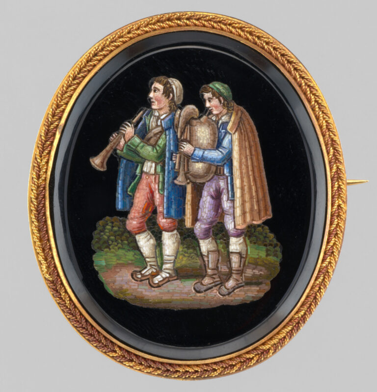 European bagpipes - a brooch with shepherds playing Italian bagpipes